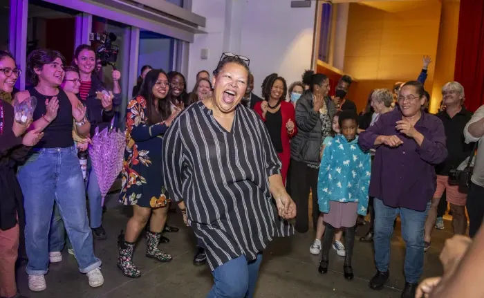 Sarah Willie-LeBreton dances with Smith community members at her inauguration party.